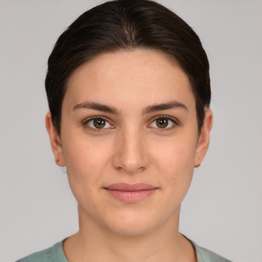 Joyful white young-adult female with short  brown hair and brown eyes