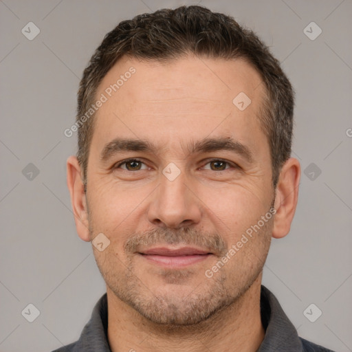 Joyful white adult male with short  brown hair and brown eyes