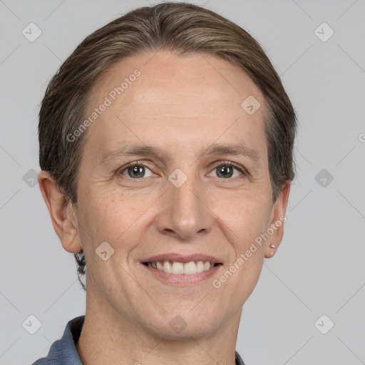 Joyful white adult female with short  brown hair and grey eyes