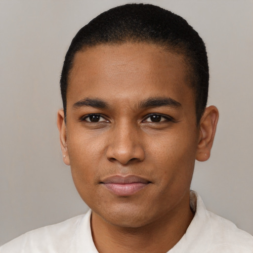 Joyful black young-adult male with short  black hair and brown eyes