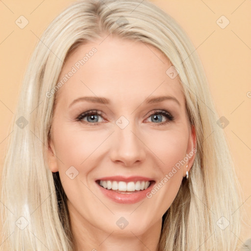 Joyful white young-adult female with long  brown hair and blue eyes