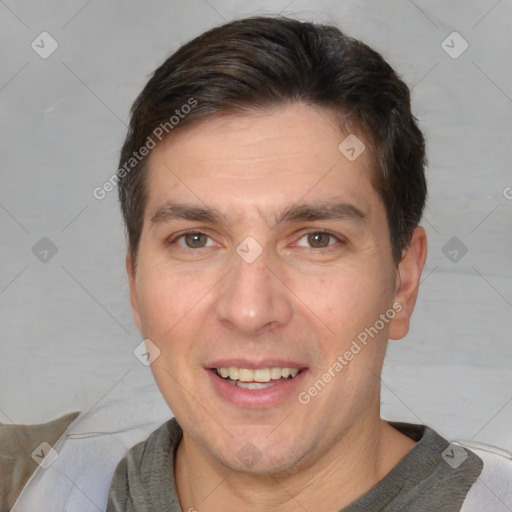 Joyful white adult male with short  brown hair and brown eyes