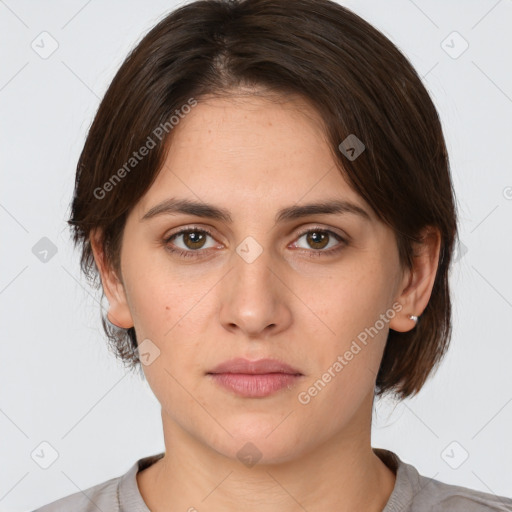 Neutral white young-adult female with medium  brown hair and brown eyes