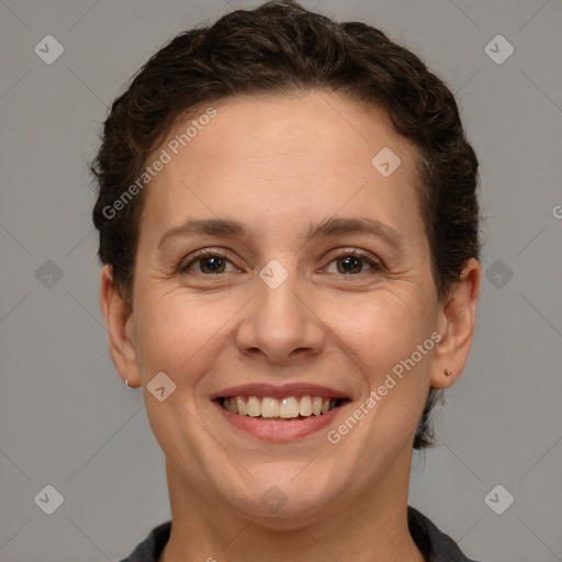 Joyful white adult female with short  brown hair and brown eyes