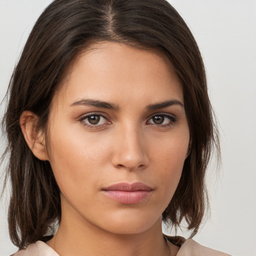 Neutral white young-adult female with medium  brown hair and brown eyes