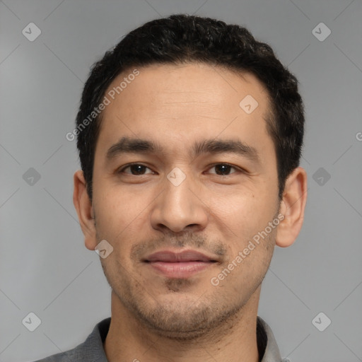 Joyful white young-adult male with short  black hair and brown eyes