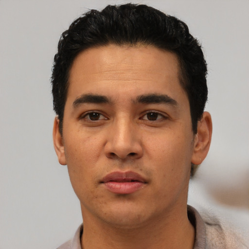 Neutral latino young-adult male with short  black hair and brown eyes