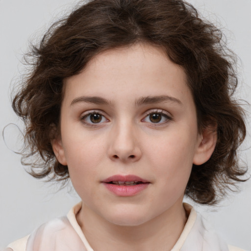 Joyful white child female with medium  brown hair and brown eyes