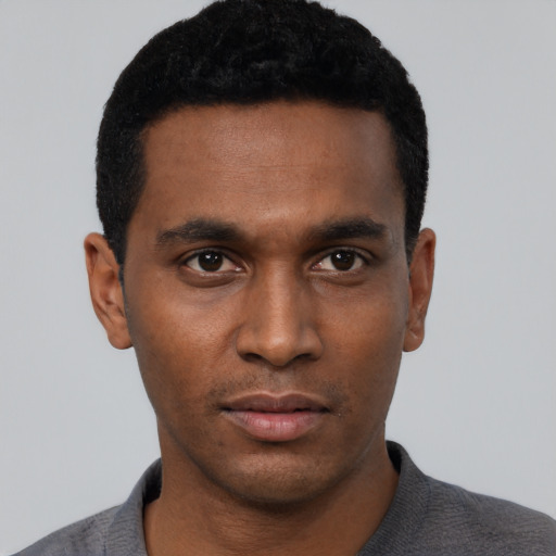 Neutral black young-adult male with short  black hair and brown eyes