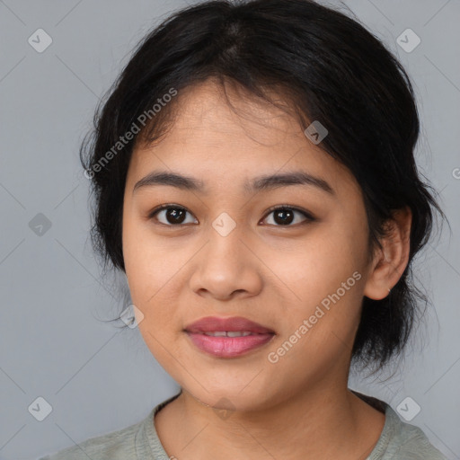 Joyful asian young-adult female with medium  black hair and brown eyes