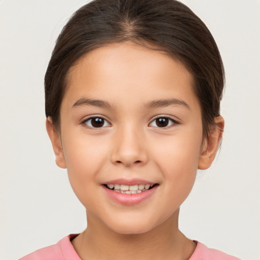 Joyful white child female with short  brown hair and brown eyes