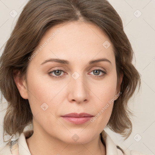 Joyful white young-adult female with medium  brown hair and green eyes