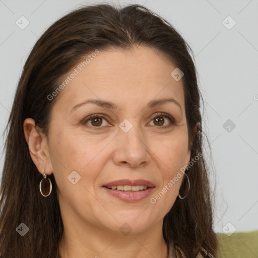 Joyful white adult female with long  brown hair and brown eyes