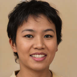 Joyful asian young-adult female with short  brown hair and brown eyes