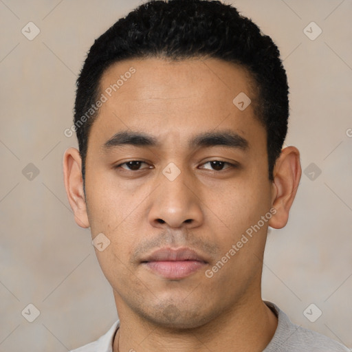 Neutral latino young-adult male with short  black hair and brown eyes