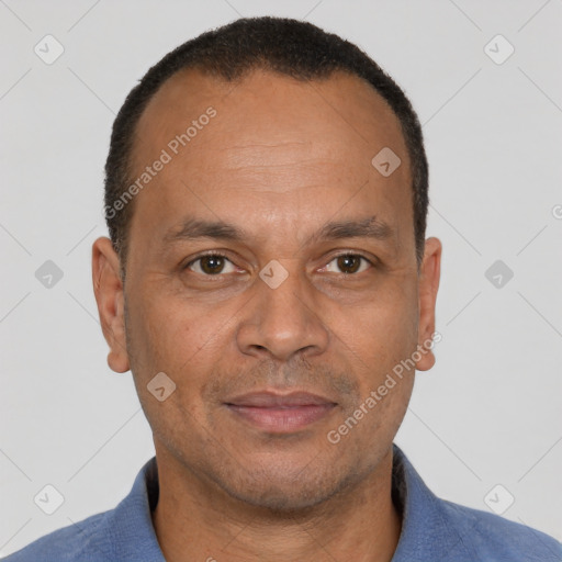 Joyful latino adult male with short  brown hair and brown eyes