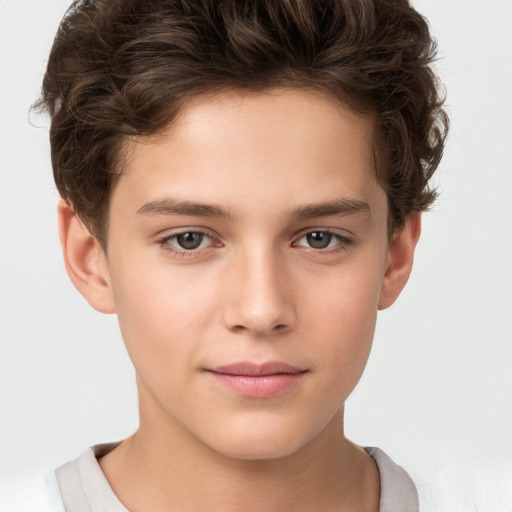 Joyful white child male with short  brown hair and brown eyes