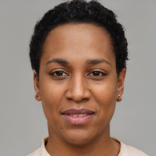Joyful latino young-adult female with short  black hair and brown eyes