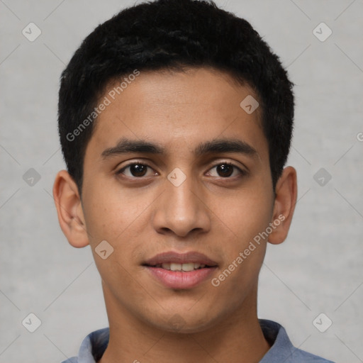 Joyful latino young-adult male with short  black hair and brown eyes