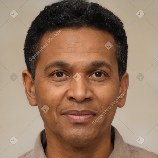 Joyful latino adult male with short  black hair and brown eyes