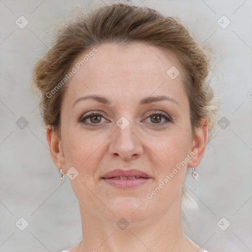 Joyful white adult female with short  brown hair and grey eyes