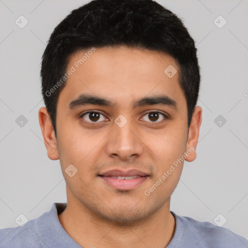 Joyful latino young-adult male with short  black hair and brown eyes