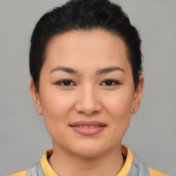 Joyful asian young-adult female with short  brown hair and brown eyes