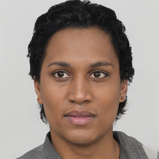 Neutral black young-adult female with short  black hair and brown eyes