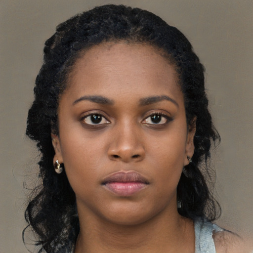 Neutral black young-adult female with long  black hair and brown eyes