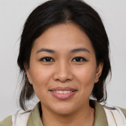 Joyful white young-adult female with medium  brown hair and brown eyes