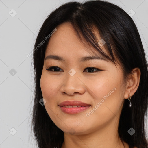 Joyful asian young-adult female with long  brown hair and brown eyes