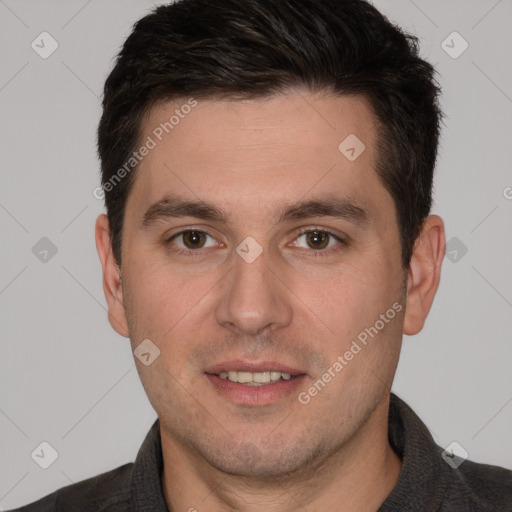 Joyful white young-adult male with short  brown hair and brown eyes