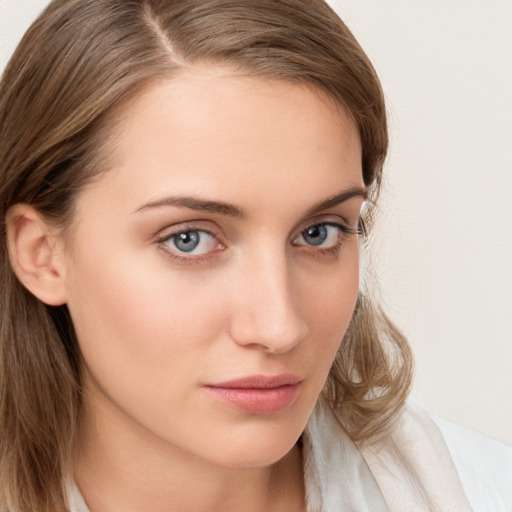 Neutral white young-adult female with medium  brown hair and blue eyes