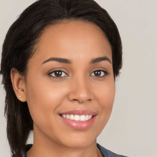 Joyful white young-adult female with long  brown hair and brown eyes