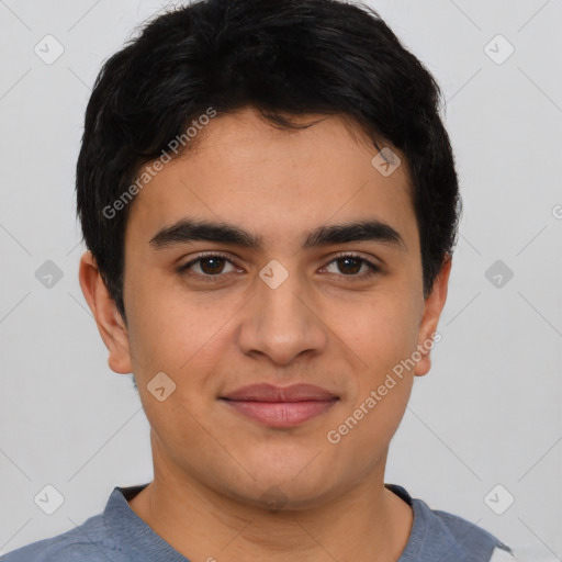 Joyful latino young-adult male with short  brown hair and brown eyes