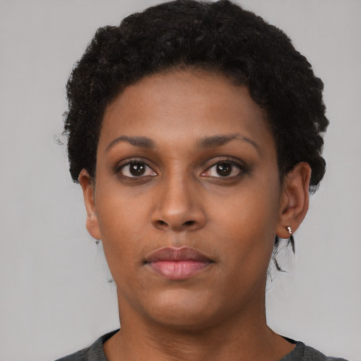 Neutral black young-adult female with short  black hair and brown eyes