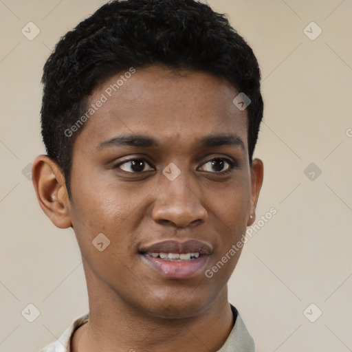 Joyful black young-adult male with short  black hair and brown eyes