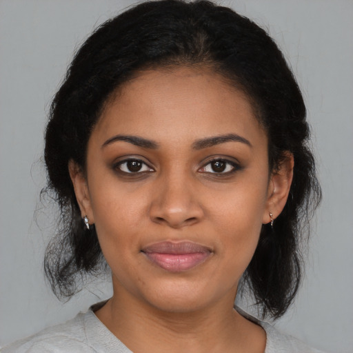 Joyful latino young-adult female with medium  black hair and brown eyes