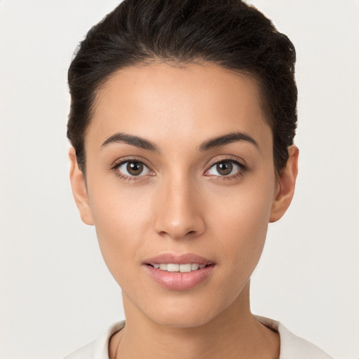 Joyful white young-adult female with short  brown hair and brown eyes