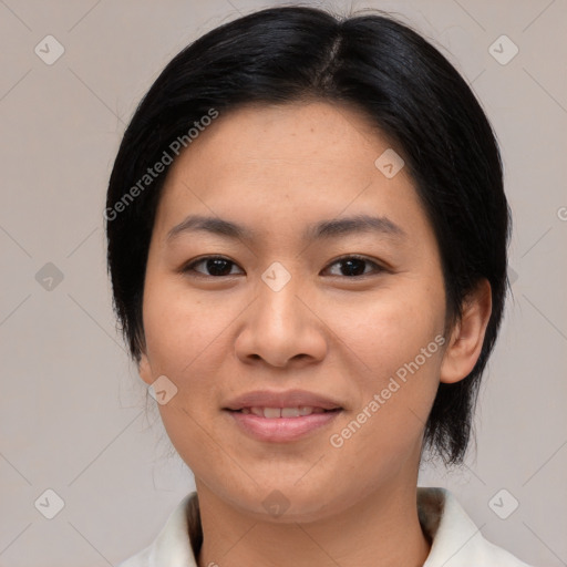 Joyful asian young-adult female with medium  black hair and brown eyes