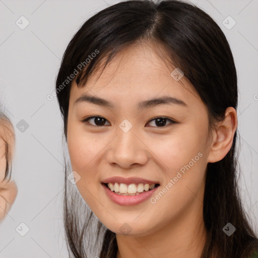 Joyful asian young-adult female with long  brown hair and brown eyes