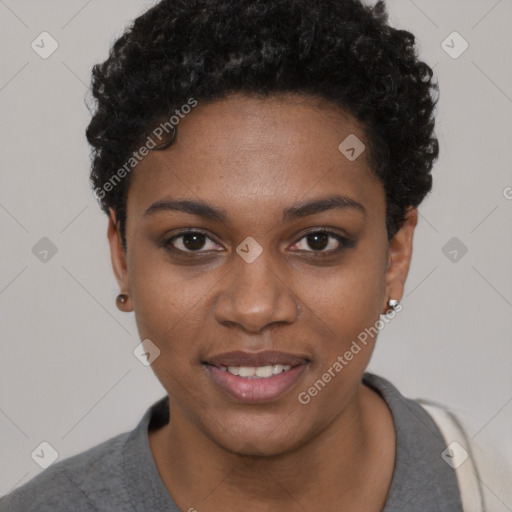 Joyful black young-adult female with short  black hair and brown eyes