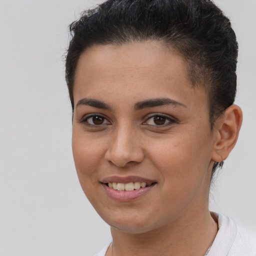 Joyful white young-adult female with short  brown hair and brown eyes