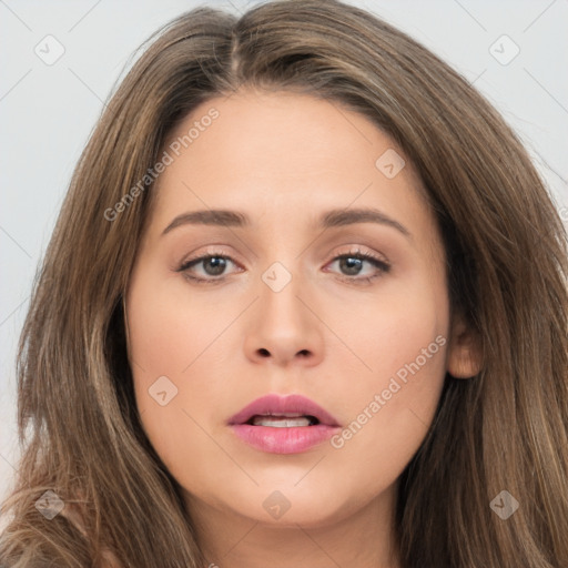 Neutral white young-adult female with long  brown hair and brown eyes