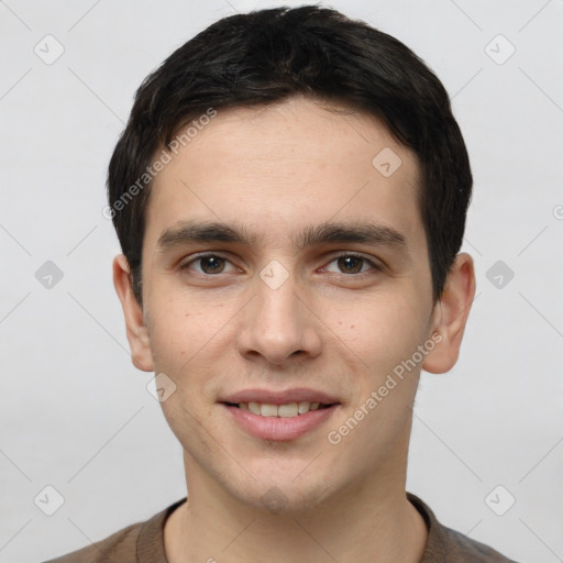 Joyful white young-adult male with short  brown hair and brown eyes