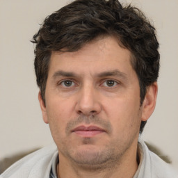 Neutral white adult male with short  brown hair and brown eyes