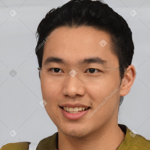 Joyful asian young-adult male with short  black hair and brown eyes