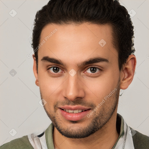 Joyful white young-adult male with short  brown hair and brown eyes