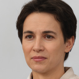 Joyful white adult female with short  brown hair and brown eyes