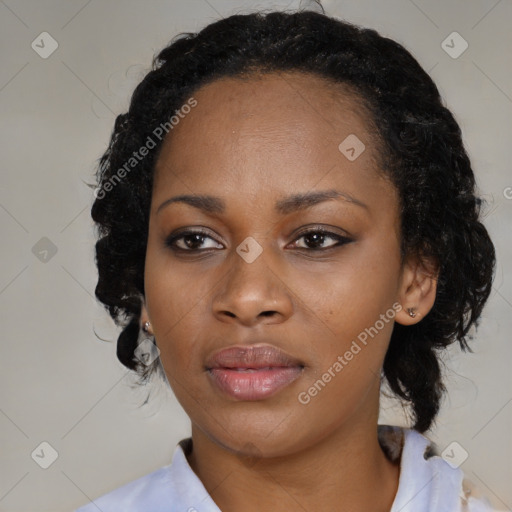 Joyful black adult female with medium  black hair and brown eyes